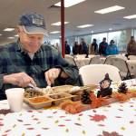 John Yeo of Sequim sits down to a traditional turkey dinner during Wednesdays Thanksgiving Eve meal at the Port Angeles Salvation Army kitchen. (Keith Thorpe/Peninsula Daily News)