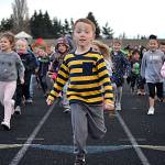 Kindergartner Dylan Purkey jumps off to a fast start during the Turkey Trot on Nov. 27. Students in kindergarten-second grade ran or walked in one group while third-fifth graders went in another for 30 minutes each. Sequim Gazette photo by Matthew Nash