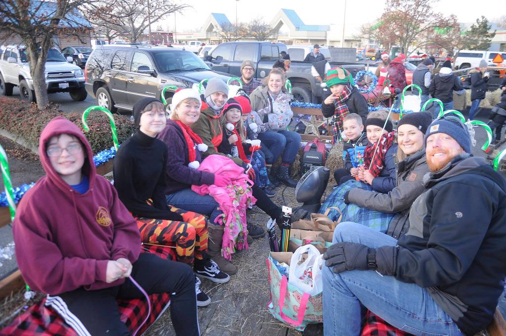 Participants in the 2019 Lighted Tractor Parade bundle up prior to the event on Nov. 30. The annual event is hosted by Sequim Museum & Arts and features holiday-decorated tractors, both new and vintage. Sequim Gazette photo by Michael Dashiell
