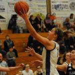 Sequim Wolves forward Hope Glasser, center, goes up for a layup against the Klahowya Eagles during the Wolves 73-17 win over the Eagles on Dec. 2. Glasser scored 11 points on the night, and was a key part in keeping the Eagles offense quiet on the night. Sequim Gazette photo by Conor Dowley