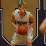 Erik Christiansen pulls down a rebound and looks to pass during the first half against the Klahowya Eagles during the Sequim Wolves 45-37 win over the Eagles on Dec. 3.