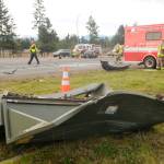 A transformer was destroyed in a wreck on Dec. 3 that sent two Sequim people and a Port Angeles woman to area hospitals. The Sequim driver was driving without insurance and a suspended license. Sequim Gazette photo by Michael Dashiell