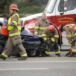 Firefighters with Clallam County Fire District 3 assess damages of a two vehicle collision on US Highway 101 near Gilbert Road on Dec. 3. Three people involved were sent to area hospitals. Sequim Gazette photo by Michael Dashiell