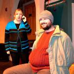 Karol (Christy Holy) calls the police on the Guy (E.J. Anderson III) as she discovers him in her house for Another Night Before Christmas. Through odd fate, the two are stuck together throughout the musical. Sequim Gazette photo by Matthew Nash