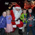 As part of Santas Toy and Food Brigade, Santa Claus (in similar stature to John Brygider) meets with Sequim siblings and cousins, from left, Grace Dormer, 9, Malta Bushy, 4, Sawyer Bushy, 6, and Bradly Dormer, 6, on Dec. 5 at Emerald Highlands. Santa and many volunteers traveled across Sequim Dec. 3-5 seeking donations for toys and food. Sequim Gazette photo by Matthew Nash