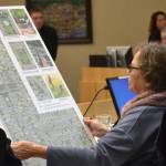 Deputy Mayor Candace Pratt holds an outline of the proposed Lavender Meadows development on Nov. 25. She voted in favor of the 217-lot manufactured home park but the proposal failed 3-3 on Dec. 9, so its developer is exploring legal options. Sequim Gazette photo by Matthew Nash