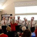 The Olympic Peninsula Mens Chorus sang a few festive carols and songs for Christmas at the Sequim-Dungeness Hospital Guilds volunteer luncheon on Dec. 12. Sequim Gazette photo by Matthew Nash