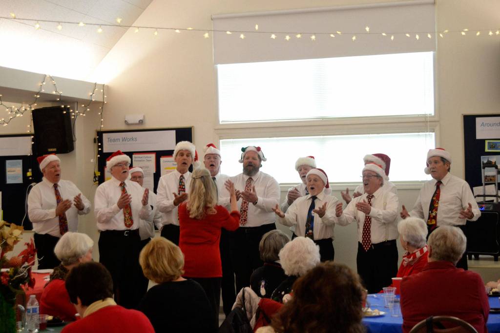 The Olympic Peninsula Mens Chorus sang a few festive carols and songs for Christmas at the Sequim-Dungeness Hospital Guilds volunteer luncheon on Dec. 12. Sequim Gazette photo by Matthew Nash