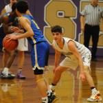 Dallin Despain (0) guards Bremerton Knights guard DAngelo Moore (1) during the first quarter of the Sequim Wolves 77-62 loss to the Knights on Dec. 17. Sequim Gazette photo by Conor Dowley