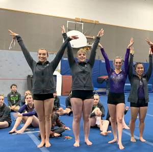 All-around winners from the Sequim-Port Angeles combined prep squads gymnastics win over Kingston on Dec. 20 are, from left, Sequims Gracie Sharp, Port Angeles Aiesha LaTourette, Sequims Emma Sharp and Sequims Lesae Pfeffer. Photo by Jackie Mangano