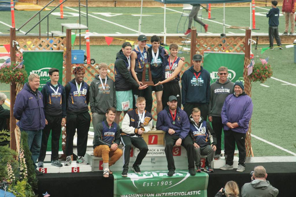 Sequim High Schools boys track & field team celebrates the schools first track team title at the Class 2A state meet at Mount Tahoma High School in Tacoma on May 25. file photo by Carol Lichten