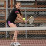Left, Jessica Dietzman returns a shot in a March 2017 league match. Right, Hope Glasser tries her hand at shot put in an April 2019 home track and field meet.