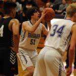Above: Sequim Wolves freshman forward Cole Smithson takes a free throw in the 
4th quarter of the Wolves 57-55 win over the Central Kitsap Cougars on Jan. 3. Smithson only scored two points on the night, but they came in the form of two crucial free throws in the last minute to help secure the win. Below: Sequim Wolves freshman forward Isaiah Moore tries to block a shot from Central Kitsap Cougars forward Ethan Searer in the third quarter Sequim Gazette photos by Conor Dowley