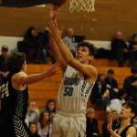 Hayden Eaton goes for a layup in the second quarter of the Wolves 57-55 win over the Central Kitsap Cougars on Jan. 3. Sequim Gazette photo by Conor Dowley