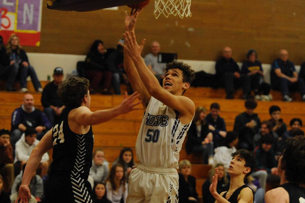 Hayden Eaton goes for a layup in the second quarter of the Wolves 57-55 win over the Central Kitsap Cougars on Jan. 3. Sequim Gazette photo by Conor Dowley