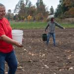 Traditional Foods Project manager Lisa Barrell and volunteer Brock Walker seed the Jamestown SKlallam Tribes new prairie with wildflowers behind the Audubon Dungeness River Center in Sequim. Photos by Tiffany Royal