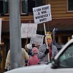 Lowell Rathbun, a group member of Indivisible Sequim and an executive board member of the Clallam County Democrats, stands dressed as President Donald Trump in opposition of a potential escalation of war with Iran over recent conflicts there.                                Sequim Gazette photos by Matthew Nash