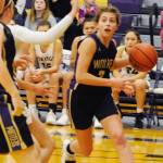 Jessica Dietzman (2) looks to pass out of the low post in the second quarter of the Sequim Wolves 55-45 win over the North Kitsap Vikings on Jan. 7.