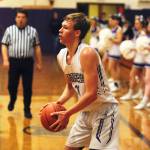 Sequim Wolves forward Stew Duncan sets up for a 3-point shot in the first quarter of the Wolves 51-49 win over the Olympic Trojans on Jan. 10. Duncan had a season-high 14 points on the night, and added eight rebounds, one block and one steal. Sequim Gazette photo by Conor Dowley