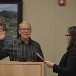 William Armacost is sworn into office on Jan. 13 by Sequim City Clerk Sara McMillon. He was also elected mayor by fellow city councilors. Sequim Gazette photo by Matthew Nash