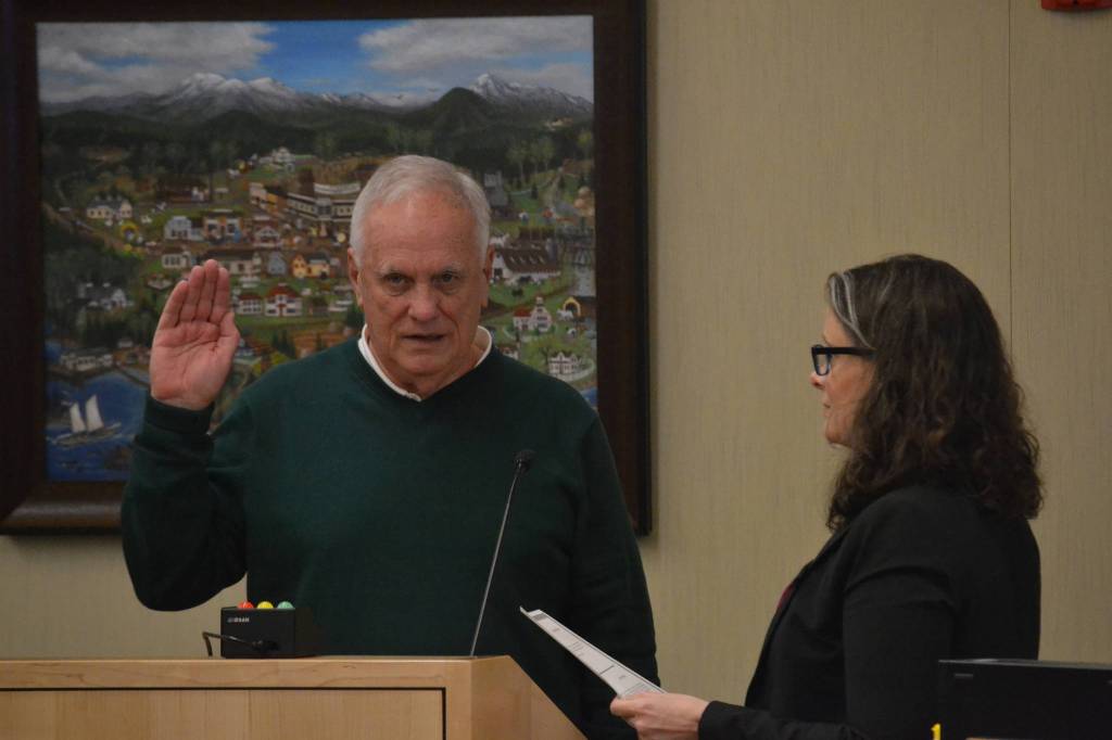 Tom Ferrelll is sworn into office on Jan. 13 by Sequim City Clerk Sara McMillon. He previously served on the citys planning commission. Sequim Gazette photo by Matthew Nash