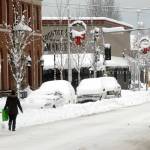 A pedestrian makes her way along a snow-covered Front Street in downtown Port Angeles on Wednesday after heavy snow blanketed the city overnight. Photo by Keith Thorpe/Olympic Peninsula News Group