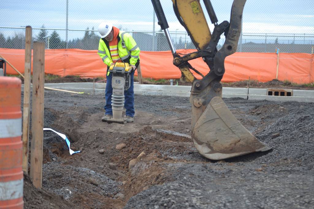 Crewmen with Interwest Construction cover an irrigation pipeline along Second Avenue on Jan. 20. City staff estimate the West Fir Street Rehabilitation Project finishing sometime between late April and late May depending on weather conditions. Sequim Gazette photo by Matthew Nash