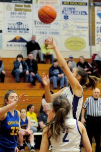 Sequim Wolves post Hope Glasser takes a fadeaway shot in the first quarter of the Wolves 85-16 win over the Bremerton Knights on Jan. 24. Glasser scored a team-high 22 points on the night, while pulling down 13 rebounds with three assists and two steals. Sequim Gazette photo by Conor Dowley