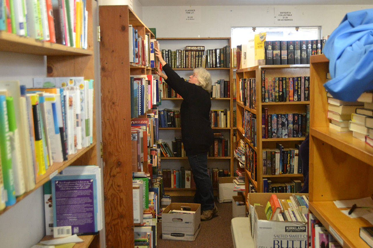 Jean Rucker, a 13-year volunteer with Friends of Sequim Library, prepares materials to sell for the Feb. 8 book sale. NOLS staff anticipate painting the outside of the building sometime this year. The Friends group gave $24,000 this year for the Summer Reading Program and speakers at the library. Sequim Gazette photo by Matthew Nash