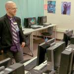 Sequim School District information technology director Beauregarde Young looks over the computers in the upstairs computer lab at the Sequim High School library. Young noted that these computers are some of the newer computers in the district, but still suffer from many of the limitations that the districts aging technology infrastructure creates. Sequim Gazette photo by Conor Dowley