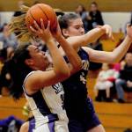 Sequim Wolves guard Hannah Bates (right) drives inside against North Kitsap Vikings guard Kamora McMillian during the second quarter of the Wolves 78-49 win over the Vikings on Jan. 31. Bates scored 16 points off the bench, and Wolves head coach Linsay Rapelje remarked after the game she was playing so well it was hard to take her off the court. Sequim Gazette photo by Conor Dowley                                Sequim Wolves post Jayla Julmist (left) goes up for a contested shot against North Kitsap Vikings guard Sophia Baugh in the first quarter of the Wolves 78-49 win over the North Kitsap Vikings on Jan. 31. Sequim Gazette photo by Conor Dowley