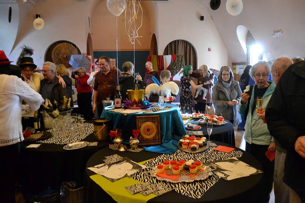 Community members enjoyed videos, food and memorabilia on Feb. 1 for Olympic Theatre Arts 40th anniversary open house. Sequim Gazette photo by Matthew Nash