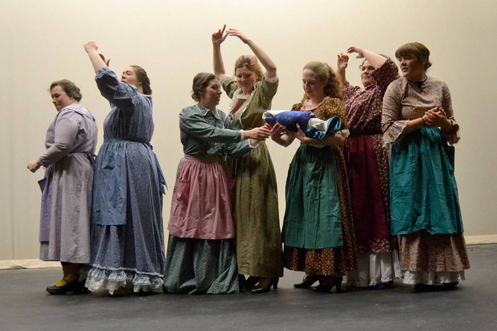 A group of women form a wagon train during their journey of Quilters to depict some of the hardships they encounter on the frontier trail. Sequim Gazette photo by Matthew Nash