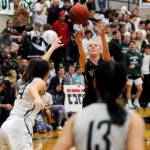 Sequims Melissa Porter puts up a shot over the Port Angeles defense in the Wolves Olympic League finale at PA on Feb. 6.