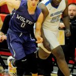 Sequims Dallin Despain (0) fights to win a loose ball with Olympic Trojans forward Malcolm DeWalt in the second quarter of the Wolves 59-47 loss to the Trojans in an Olympic League tiebreaker game on Feb. 8 that sent the Trojans to the district playoffs. Sequim Gazette photo by Conor Dowley