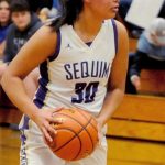 Sequim Wolves post Jayla Julmist looks for a pass from the top of the three point line during the Wolves 92-22 district playoff win over the Foster Bulldogs on Feb. 12. Julmist scored 15 points with 13 rebounds and six blocks in a dominant interior performance at both ends of the court. Sequim Gazette photo by Conor Dowley