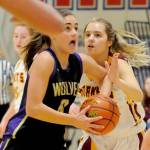Sequim Wolves forward Hope Glasser drives through traffic to attempt a layup in the third quarter of the Wolves 57-53 loss to the White River Hornets on Feb. 20. Glasser scored seven of the Wolves first 10 points and 11 overall, but the Wolves came up short in the final few minutes against the Hornets in a district playoff loser-out game on Feb. 20 to qualify for the regional round of the 2A State Championships. Sequim Gazette photo by Conor Dowley