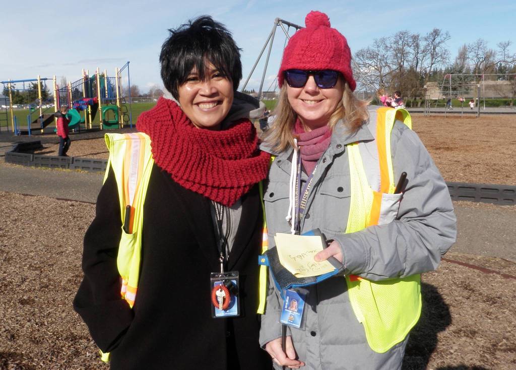 Math paraeducator Eliza Klinger, left, and Veronica Catelli, basic education and reading paraeducator, in addition to working one-on-one with students in classrooms, also provide supervision on the Helen Haller Elementary School playground. Photos by Patsene Dashiell