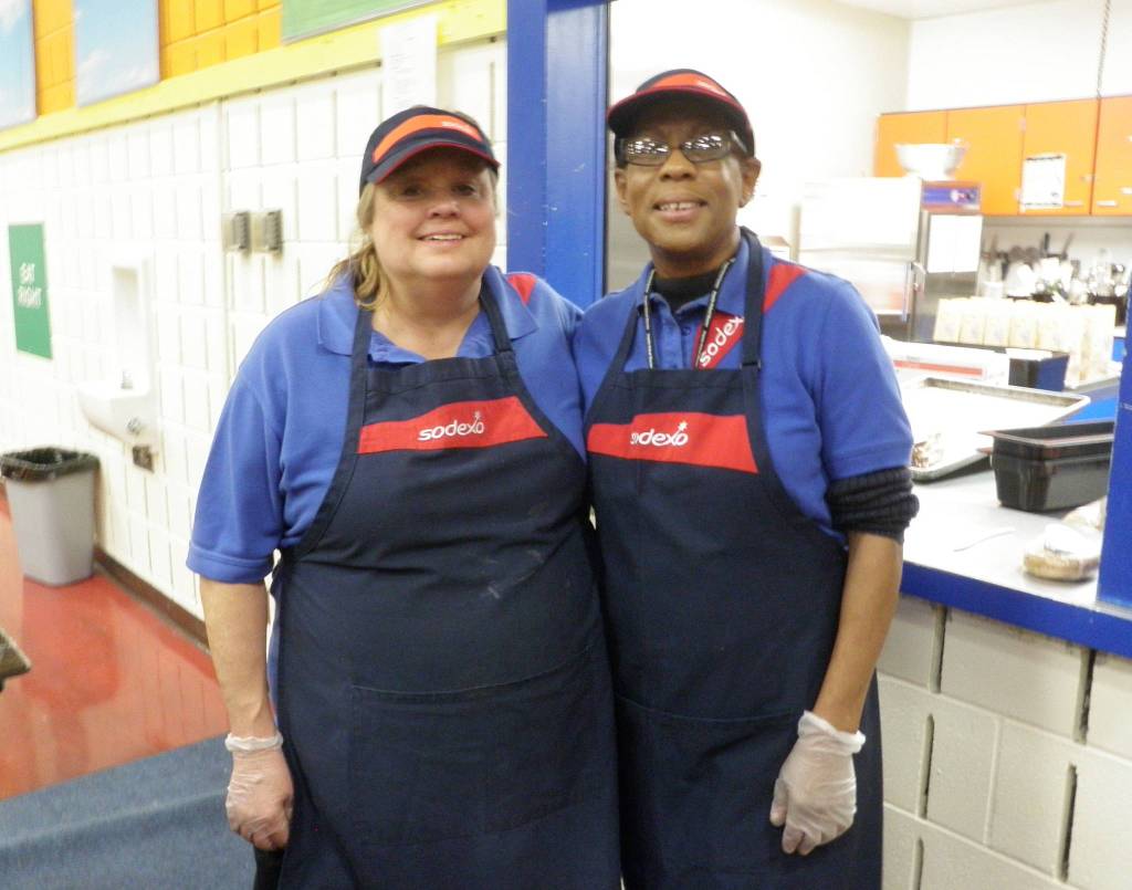 Sodexo Food Service workers Debby Brault, left, and Shirley Sheppard prepare breakfast and lunch service for students.