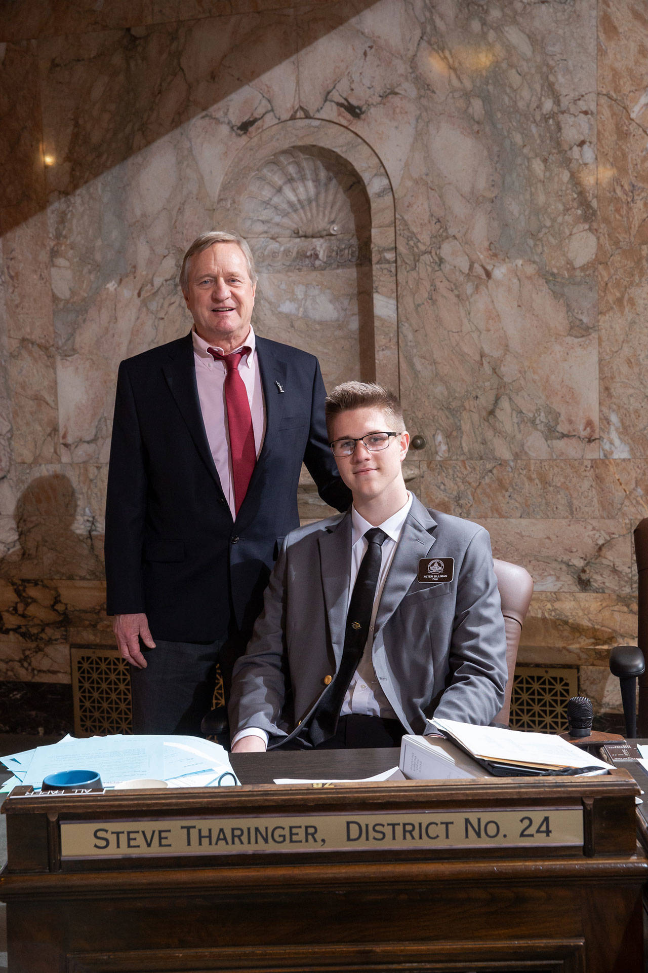 Sequim High School junior Peter Silliman serves as a page this week in the Washington State House of Representatives last week. Sponsored by Rep. Steve Tharinger (D-Port Townsend), Silliman is the son of Cliff Silliman of Sequim. Pages assume a wide variety of responsibilities from presenting the flags to distributing amendments on the House floor. They also receive daily civics instruction, drafting their own bills and participating in mock committee hearings. Photo courtesy of Washington State Legislative Support Services