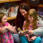 Abigail Schroeder shares a corner with Jody Hamilton and Piper Jackson to read together during Read Across America Day in Rachel Odens third grade class. Sequim Gazette photos by Matthew Nash