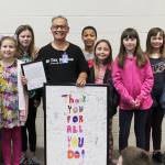 Above, Celebrating their lead custodian Nguyen Tuat Van (Mr. Young), at center, are Greywolf students (from left); Maia Brewer, Allora Inman, Charlotte Rogers, Bridgette Pyeatt, Myles Taylor, Inara Miles, Megan Simpler, MacKenzye Tate and Addison Tate. In back is club advisor Sheri Burke. Left, Members of Carlsborg Veterans of Foreign Wars Post 6787 honor Greywolf Elementary School kindergarten teacher Kelli Mishko (third from left) with their 2020 VFW Teacher of the Year Award. At far left is school principal Donna Hudson. 
Submitted photo