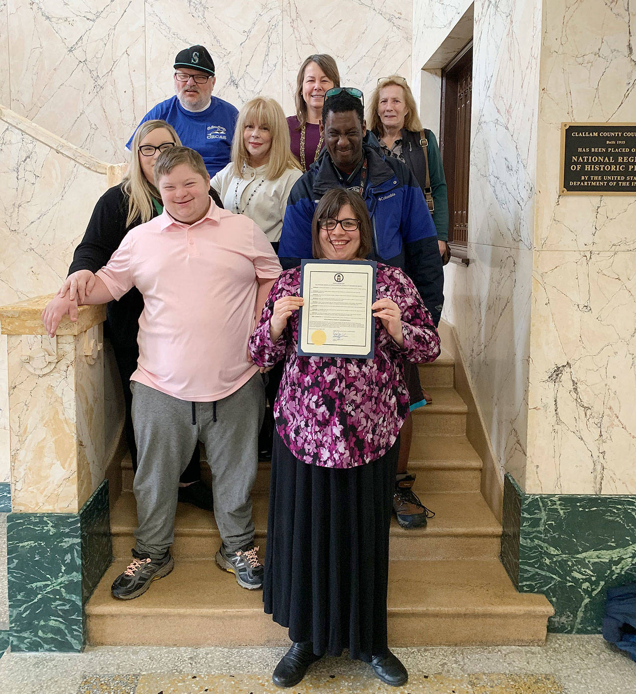 Celebrating Developmental Disabilities Awareness Month are (back row, from left) Patrick McFarland, Virginia ONeil and Karen Pierce, (middle row, from left) Shawnda Hicks, Kelley Lawrence and Tony Andrus, and (in front, from left) Grayson Hicks and Riley ONeil. Photo by Chelsea Lierly