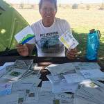 Left, Kuntz with some of the inspirational postcards he received along the way during his kayak trip on the Columbia River. He paddled from source to sea in honor of Erica (Eri) Reith (Eri), who tragically lost her life in a car accident at age 19, and to teach youth the art of adventure. Submitted photo