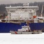The U.S. Coast Guard Cutter Osprey sails past the tanker ship Polar Endeavour on Tuesday, March 3, 2020, in Port Angeles Harbor. (Keith Thorpe/Peninsula Daily News)