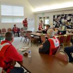 Red Cross volunteers debrief before a training exercise in St. Lukes Episcopal Church. Photo courtesy of Don Zanon