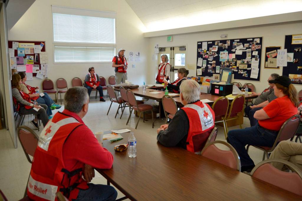 Red Cross volunteers debrief before a training exercise in St. Lukes Episcopal Church. Photo courtesy of Don Zanon