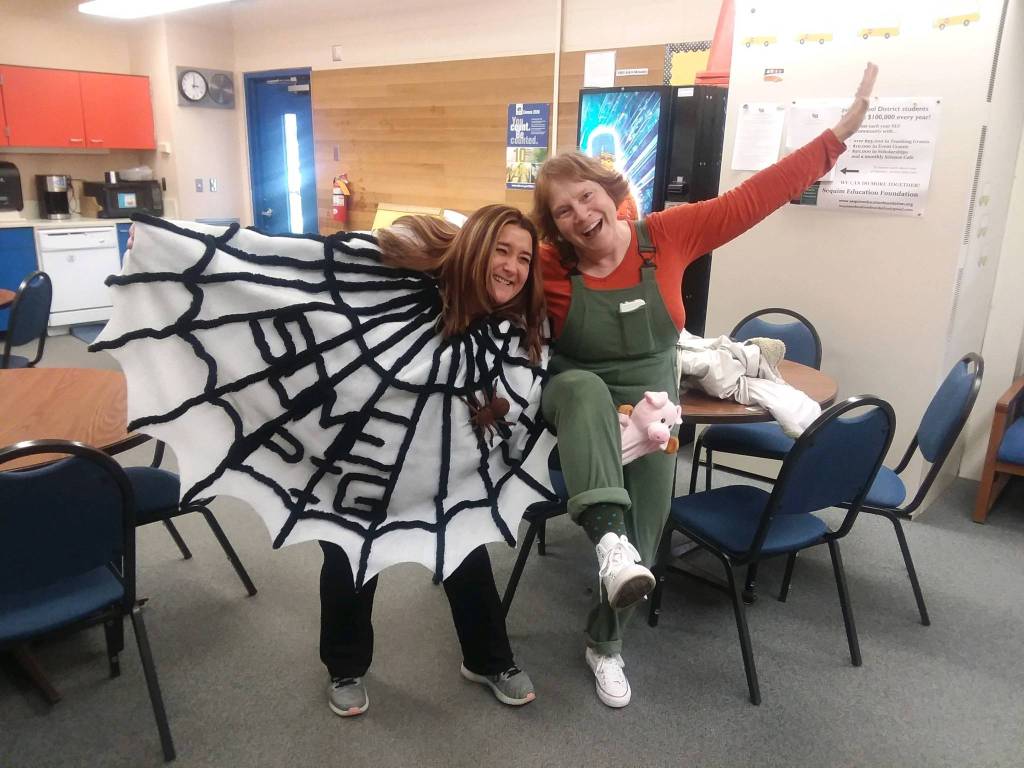 Teachers Christine MacDougall Danielson, right, dressed as Clementine from the Sara Pennypacker book series, and Doreen Minard as Charlotte, the spider from Charlottes Web by E.B. White, show their costumes on March 6 at helen Haller Elementarys Book Character Day. Photo by Patsene Dashiell