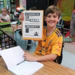Third-grader Ryder McCreary from Emily Ellefsons classroom at Helen haller Elementary School fills in new answers to clues in his Spy Folder. Every day students earn clues to help them solve the case of the alien (extraterrestrial) who is trying to take over the International Space Station. Photo by Patsene Dashiell