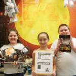 Third-graders (from left) Sophia Mager, Addison Carver and David Herman in Carolyn Luengens classroom at Helen Haller Elementary School are learning facts about the solar system. Photo by Patsene Dashiell